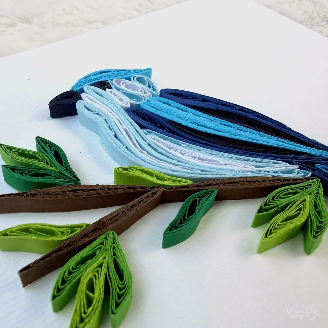 Handmade quilled blue jay greeting card, blue songbird perched on a brown branch with green leaves, paper art by Vonderly