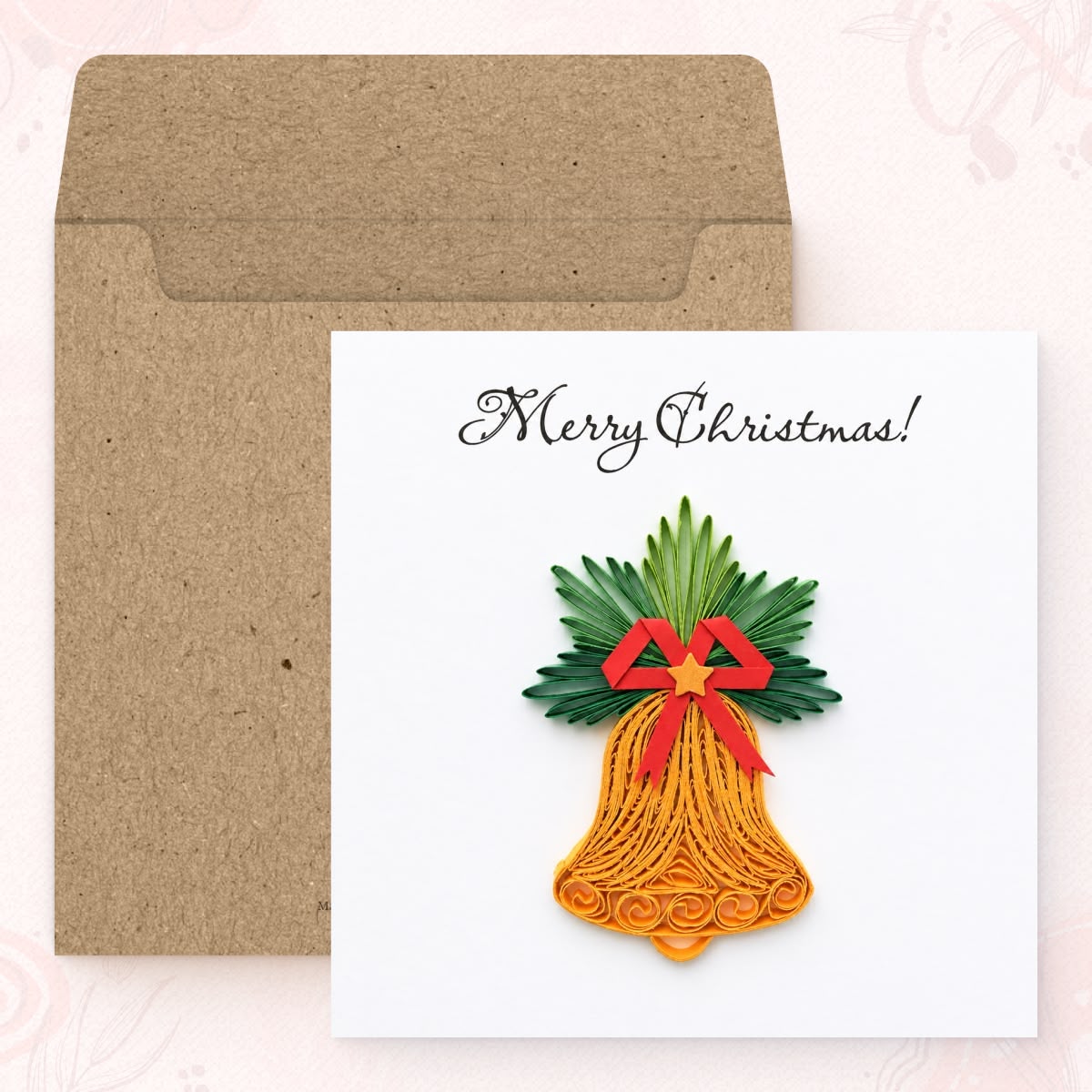Christmas Bell quilled greeting card shown with its square kraft envelope.