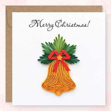 Quilled Christmas card with a gold paper bell, red bow, and green pine sprays.
