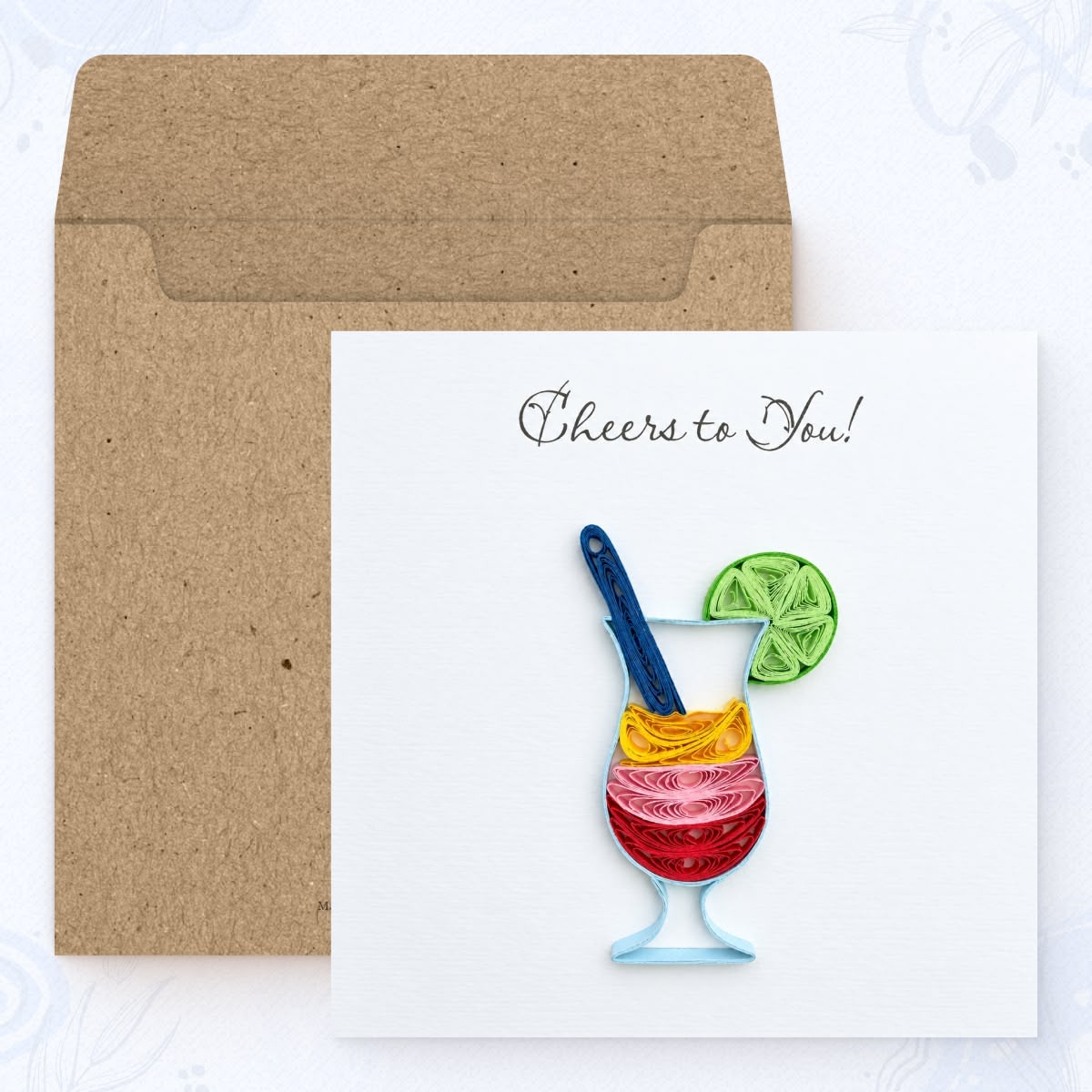 Cocktail quilled greeting card shown with its square kraft envelope.