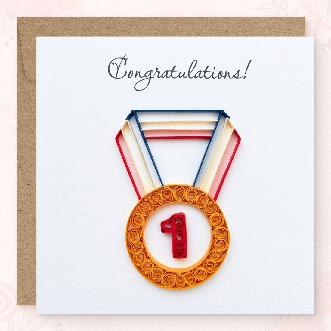 Quilled congratulations card with a gold paper medal and red number 1 on a navy, cream, and red ribbon.