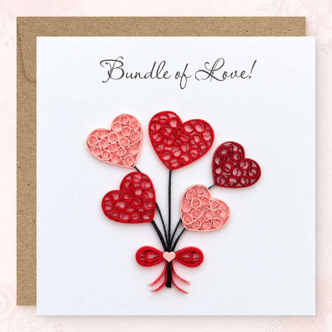 Heart Balloons quilled greeting card with five coil-filled hearts in red and pink paper on black strings, printed "Bundle of Love!" above.