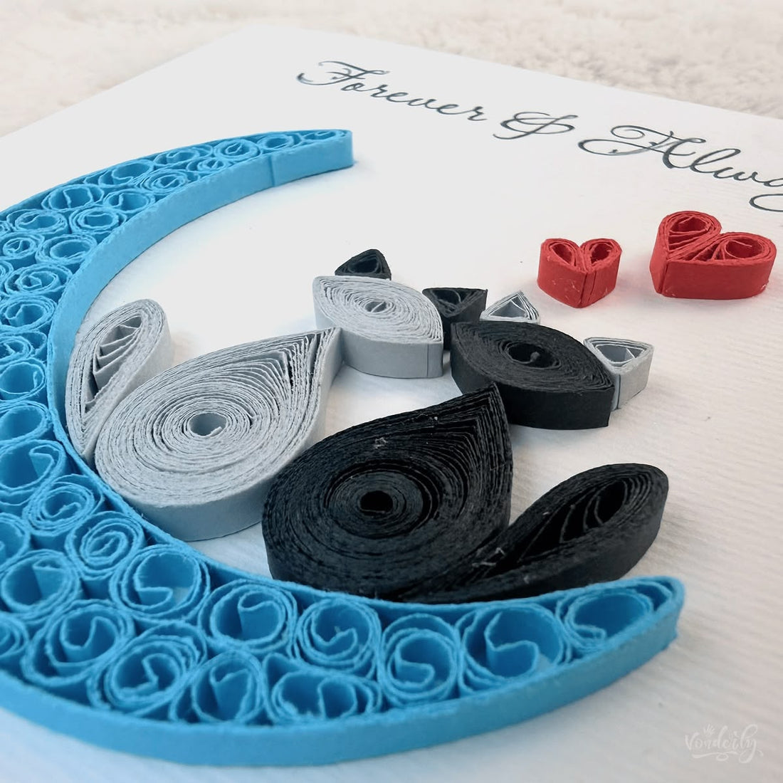 Handmade quilled anniversary greeting card, two cats (one gray, one black) sitting on a blue crescent moon with two red hearts above and "Forever & Always" printed in calligraphic script, paper art by Vonderly