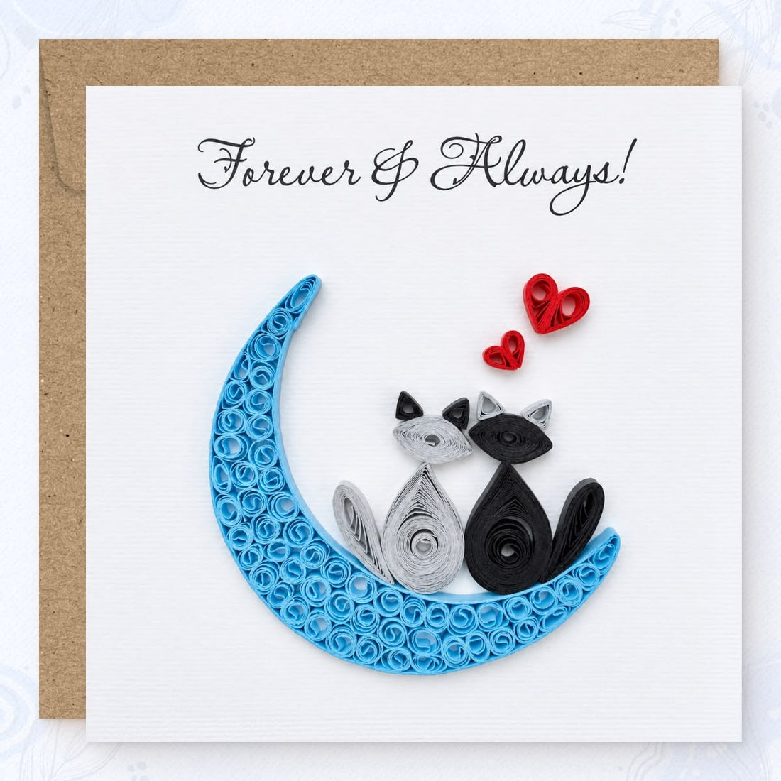 Moon Cats quilled greeting card with two cats, a blue crescent and red hearts beneath the printed Forever & Always wish.