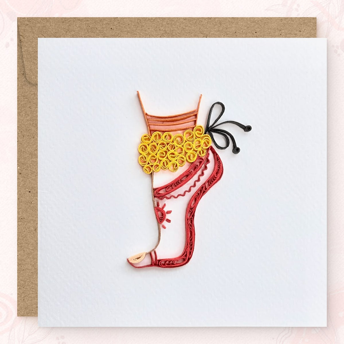 Handmade quilled Bharatanatyam dance greeting card, dancer's leg in classical pose with golden ankle bells, red alta foot, and coral striped costume hem, paper art by Vonderly