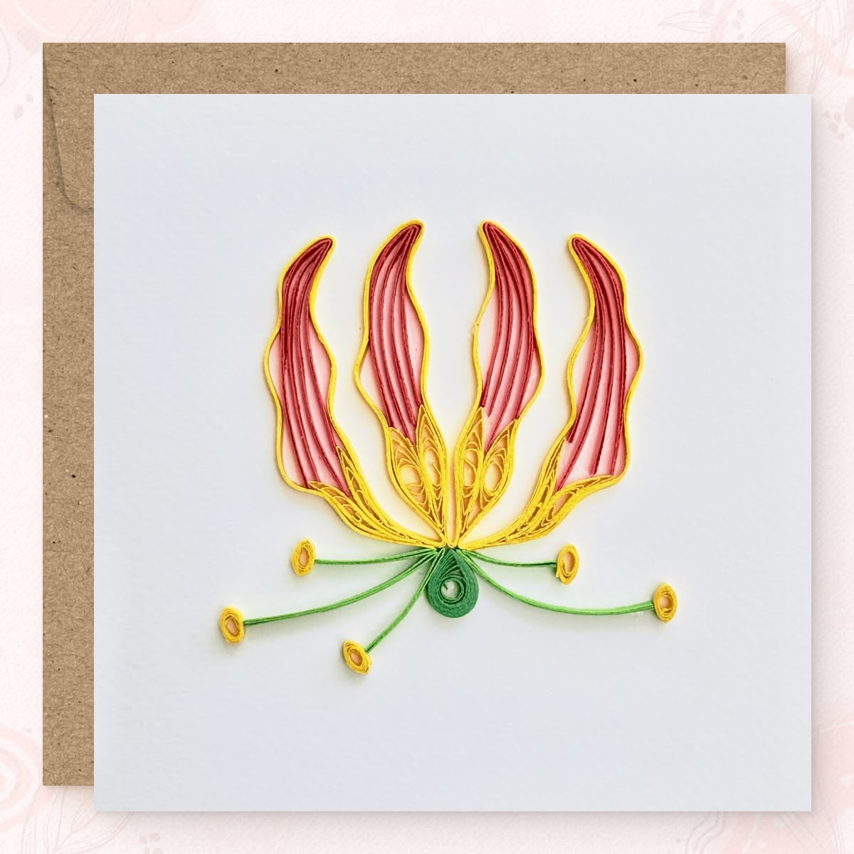 Handmade quilled flame lily greeting card, four upward-curving petals in coral red with yellow edges and a central yellow stamen, paper art by Vonderly
