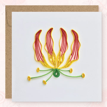 Handmade quilled flame lily greeting card, four upward-curving petals in coral red with yellow edges and a central yellow stamen, paper art by Vonderly