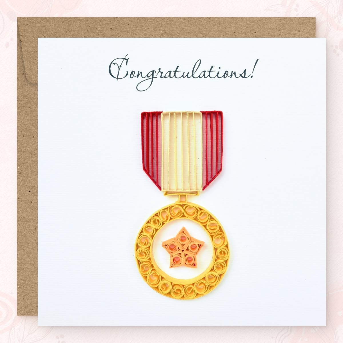 Handmade quilled congratulations greeting card with a gold service-style medal and orange star at its center, hanging from a red and cream striped ribbon, "Congratulations" printed in calligraphic script, paper art by Vonderly