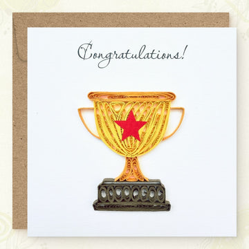 Handmade quilled congratulations greeting card with a gold championship trophy and red star, dark brown base, "Congratulations" printed in calligraphic script, paper art by Vonderly