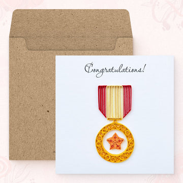 Star Medal quilled greeting card shown with its square kraft envelope.
