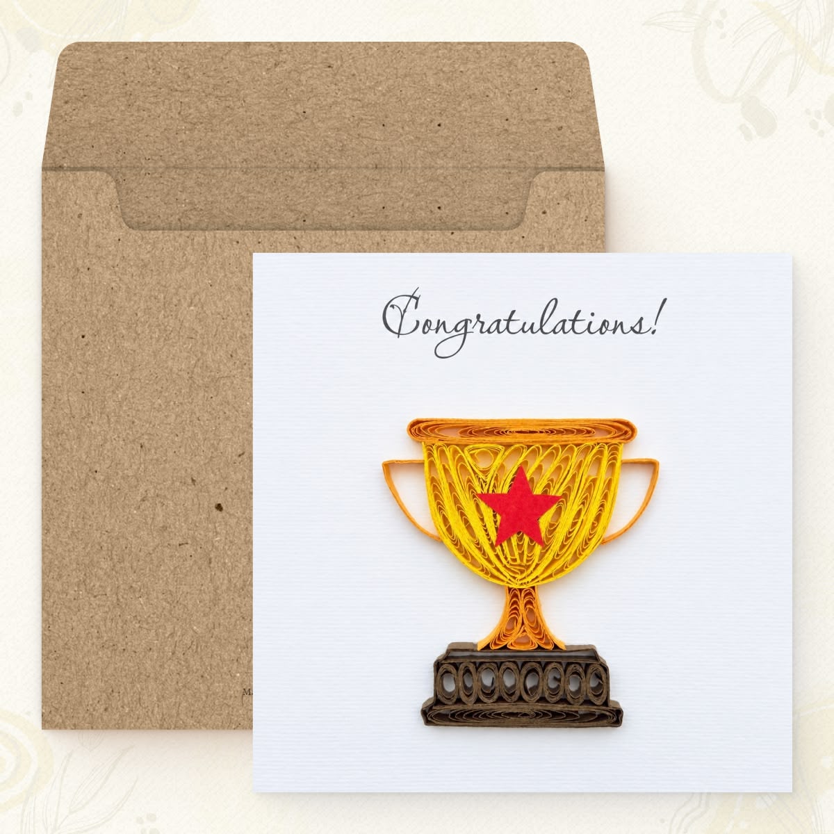 Trophy quilled greeting card shown with its square kraft envelope.