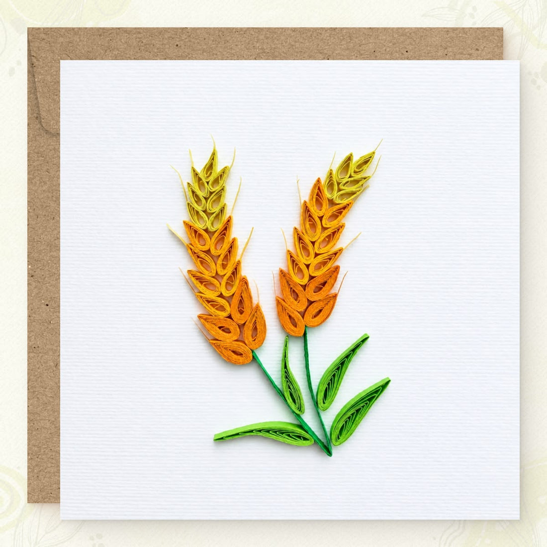 Wheat Stalks quilled greeting card with two paper wheat heads in yellow, gold, and orange above green leaves.