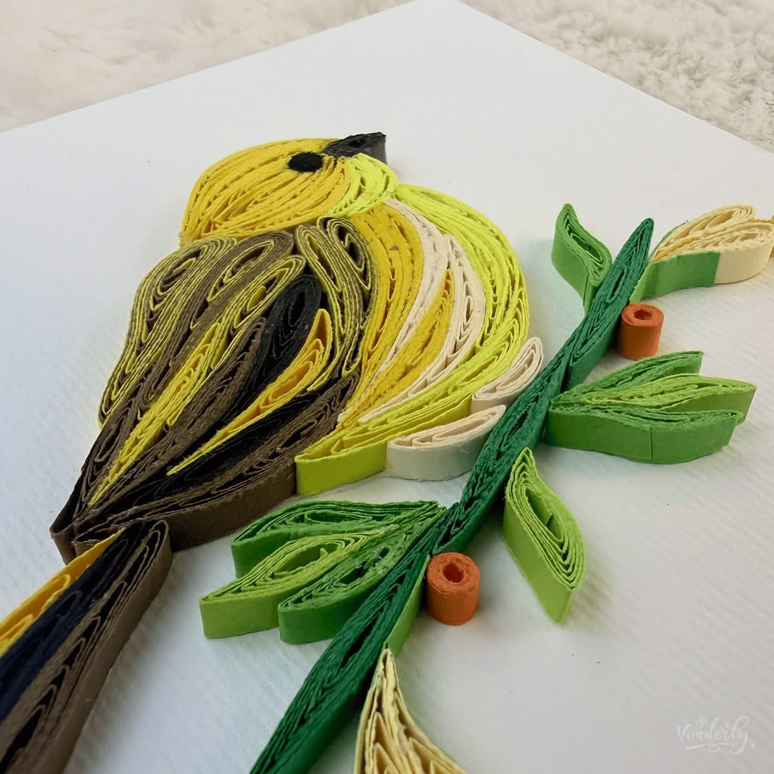 Handmade quilled yellow warbler greeting card, bright yellow songbird perched on a green branch with brown wing patches and orange berries, paper art by Vonderly